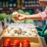 Woman buying at grocery store